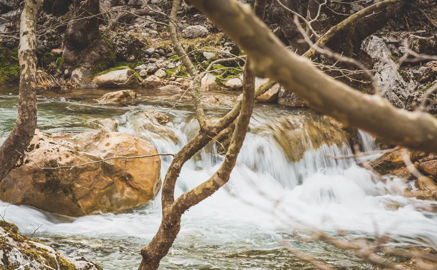 White water around a golden boulder