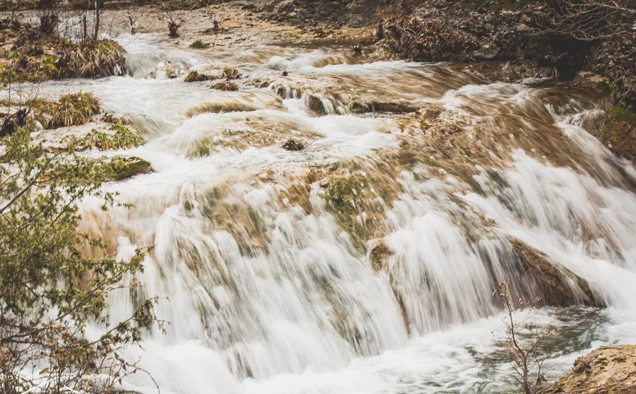 A cascade falling over rock in several steps