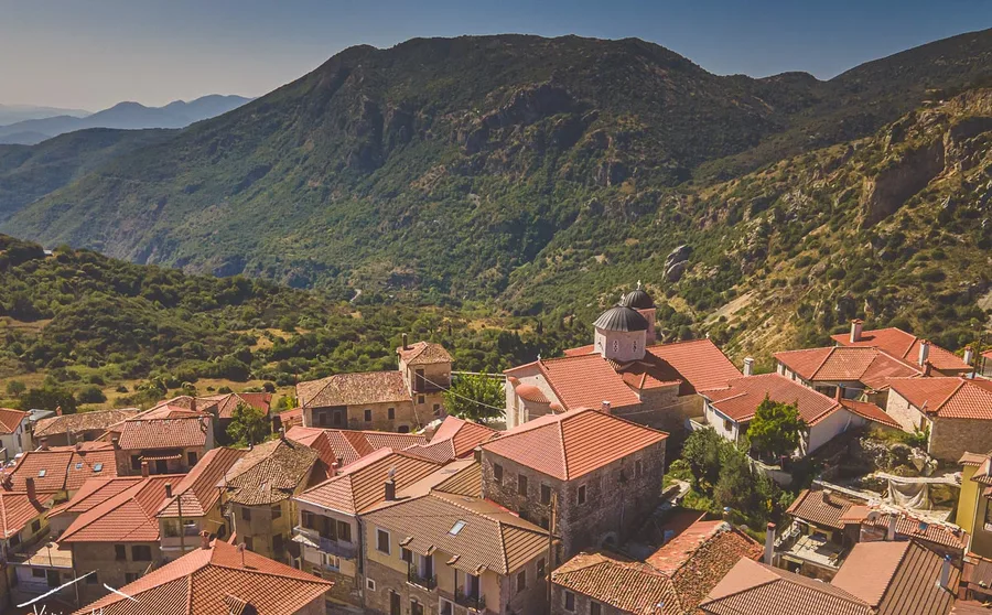 Red roofs of a village above the valley