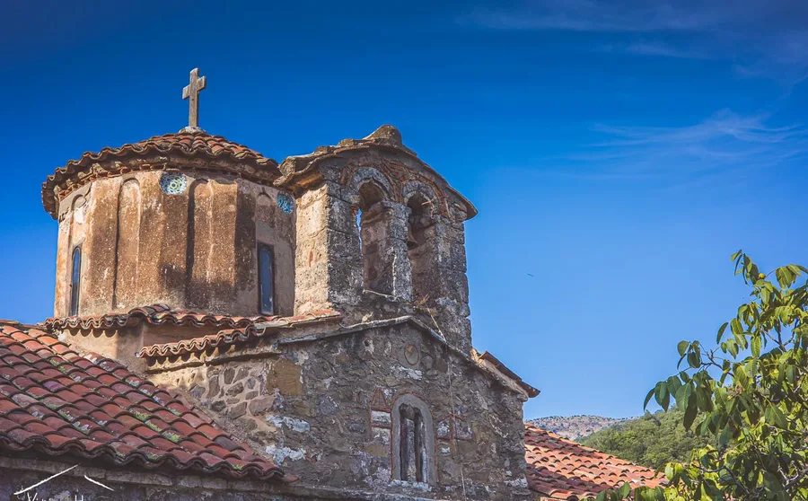 A domed stone church against blue sky