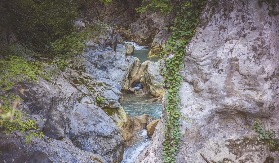 A narrow cut in the rock with water running