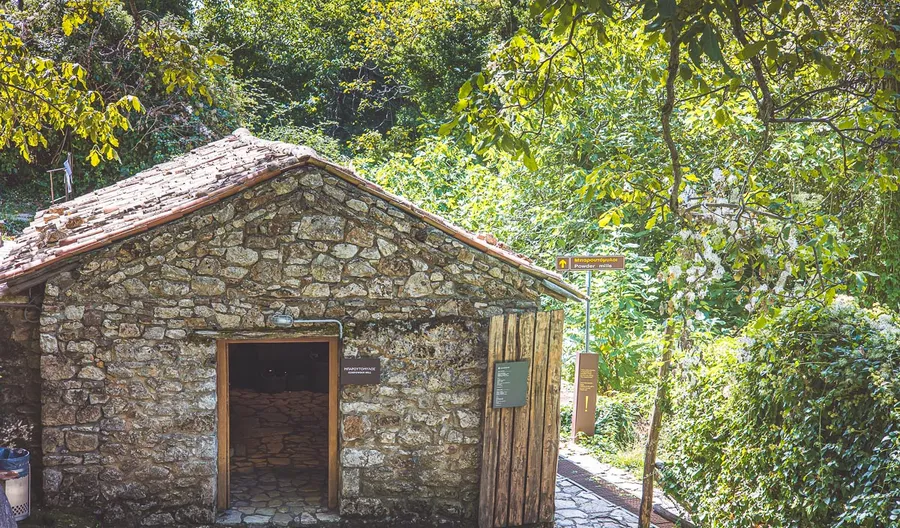 A small stone building beside the path