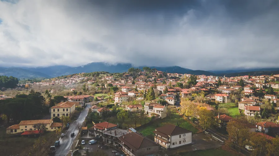 Vitina seen from above: red roofs and the valley