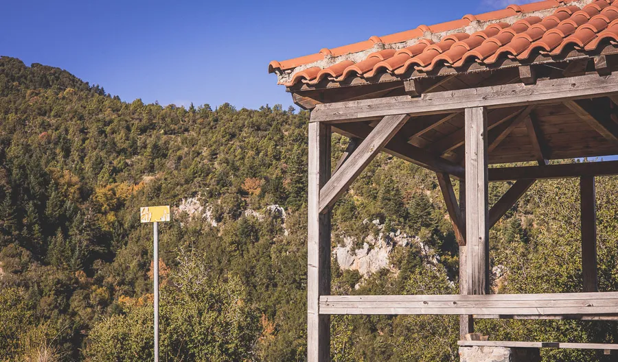 A timber shelter on a ridge along the trail